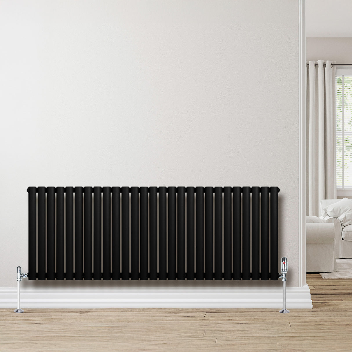 Radiador de coluna simples oval preto, 600 mm x 1620 mm, com acabamento liso e válvulas cromadas, instalado em parede clara