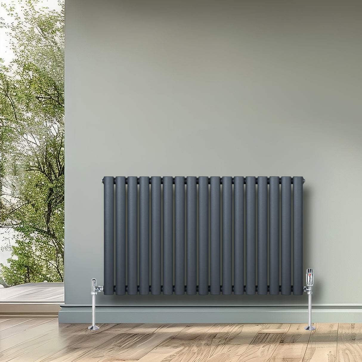 Radiador de coluna simples oval cinza antracite, com acabamento liso e moderno, instalado em parede clara, destacando-se no ambiente