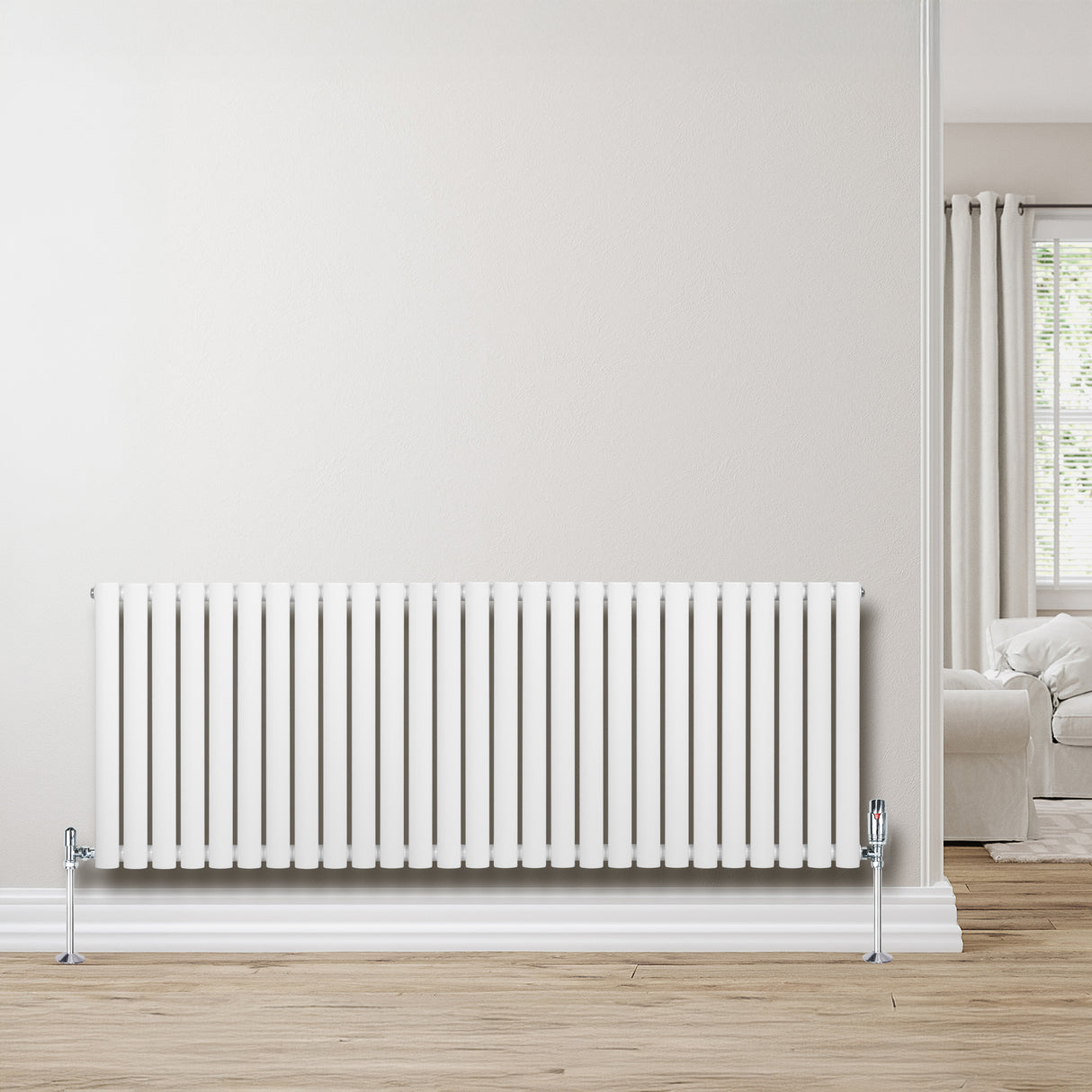 Radiador de coluna simples oval branco, 600 mm x 1620 mm, com acabamento liso e moderno, instalado em parede clara, ambiente aconchegante