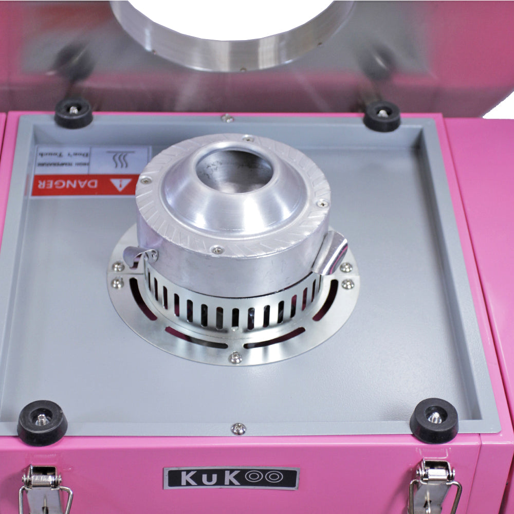 Equipamento de cozinha em tom rosa vibrante, com um motor prateado e detalhes metálicos, ideal para preparar alimentos de forma eficiente