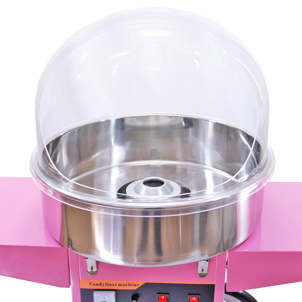 Máquina de algodão doce com estrutura rosa, tigela de aço inoxidável brilhante e tampa de plástico transparente, ideal para festas