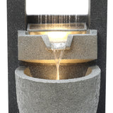 Fonte de água elétrica para jardim "Cascade Springs" em tons de cinza, com água fluindo suavemente entre camadas texturizadas e iluminadas