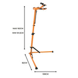 Suporte de oficina para bicicletas em laranja, ajustável de 101,5 cm a 162 cm, com base estável e garras para fixação segura