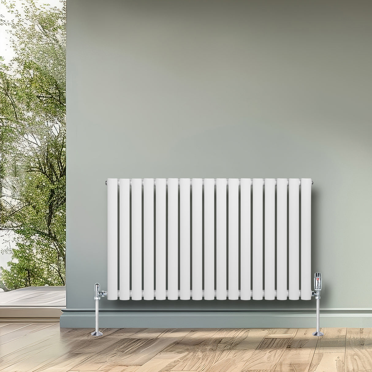Radiador de coluna oval branco com válvulas, 600 mm x 1020 mm, instalado em parede cinza, com piso de madeira clara e vista para a natureza