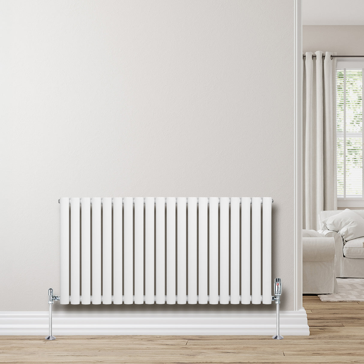 Radiador de coluna simples oval branco, 600 mm x 1200 mm, com válvulas, instalado em parede clara, piso de madeira clara