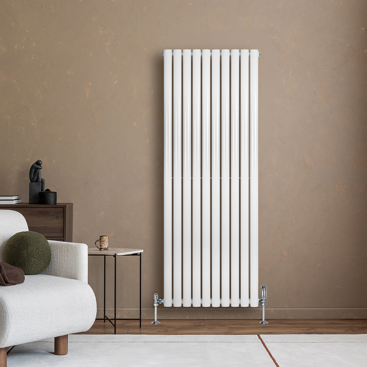 Radiador de coluna oval branco com válvulas, instalado em parede, destacando seu design moderno e acabamento liso e elegante
