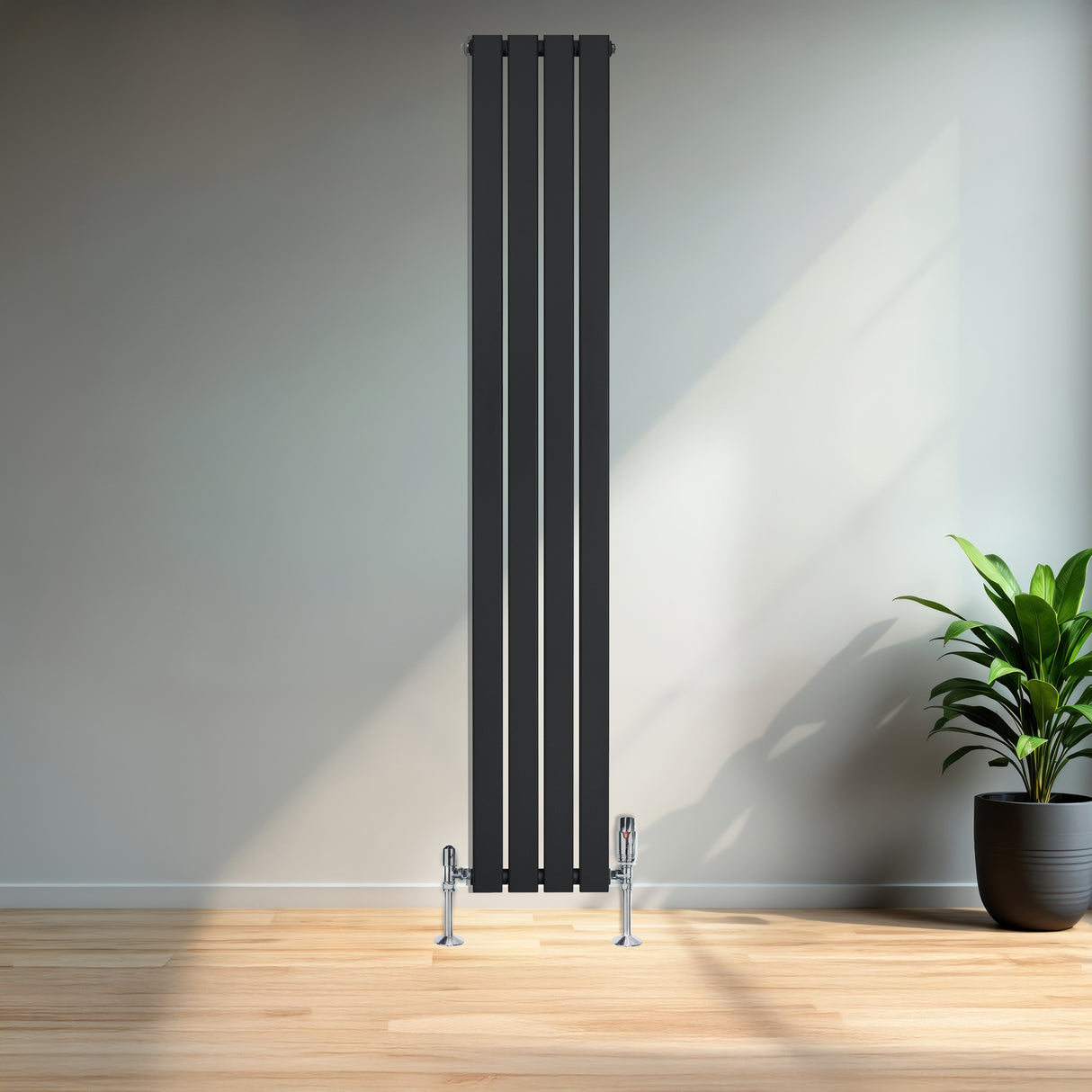Radiador plano de coluna simples preto, com design vertical e acabamento liso, instalado em parede clara, ao lado de planta em vaso