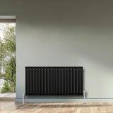 Radiador de coluna simples oval preto, 600 mm x 1200 mm, com acabamento liso e pés cromados, ideal para aquecimento de ambientes