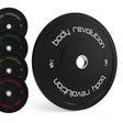 Discos bumper olímpicos pretos da Body Revolution, com pesos de 5kg, 10kg, 15kg e 25kg, destacando o design moderno e resistente